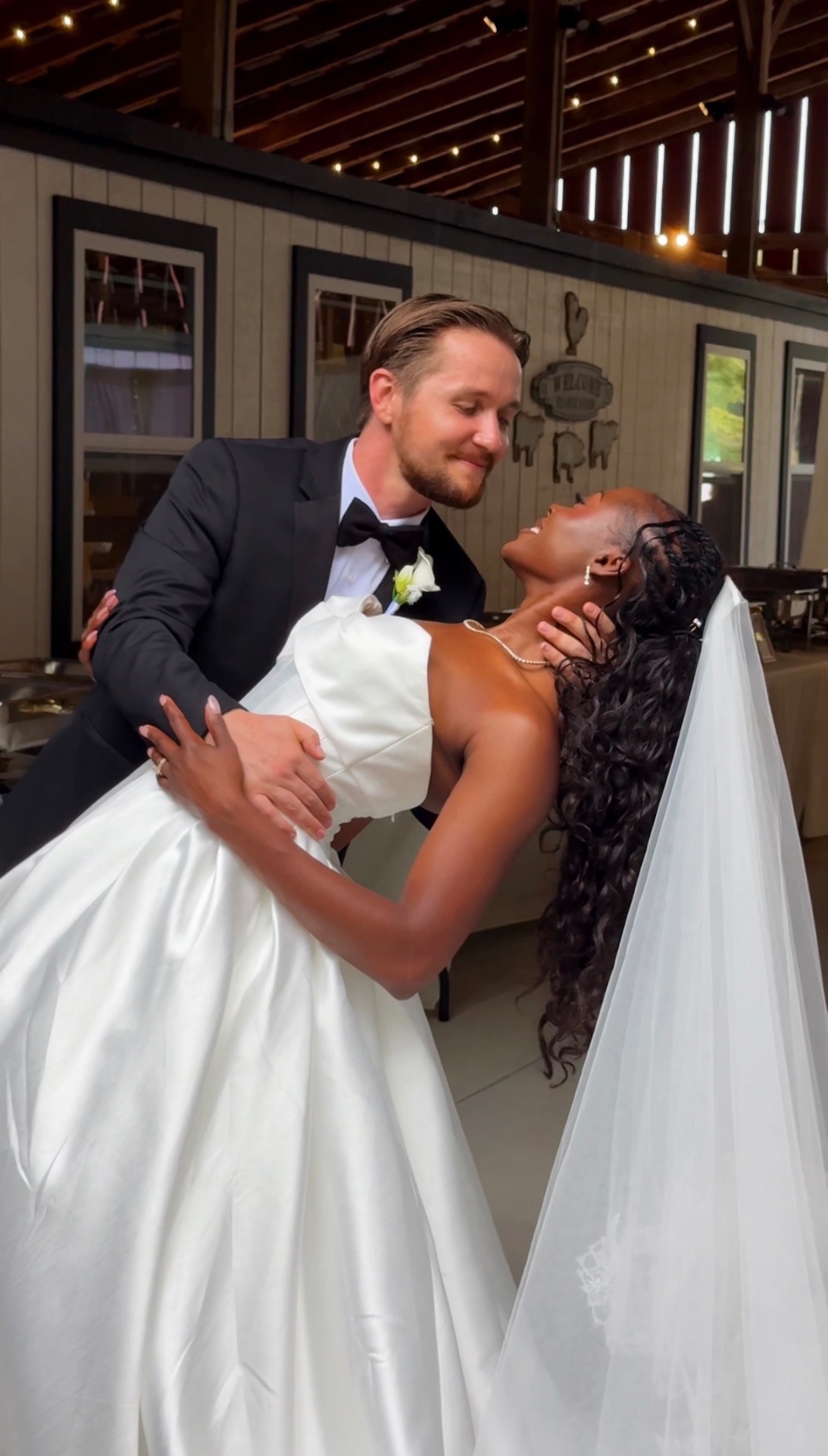 A couple sharing a wedding-day moment, captured by Aisle Social