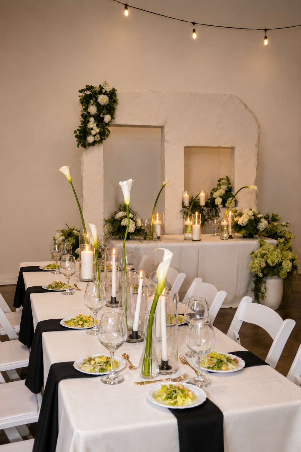 Wedding reception tablescape with candles and florals